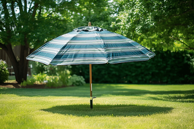 A beach umbrella standing on a lawn
